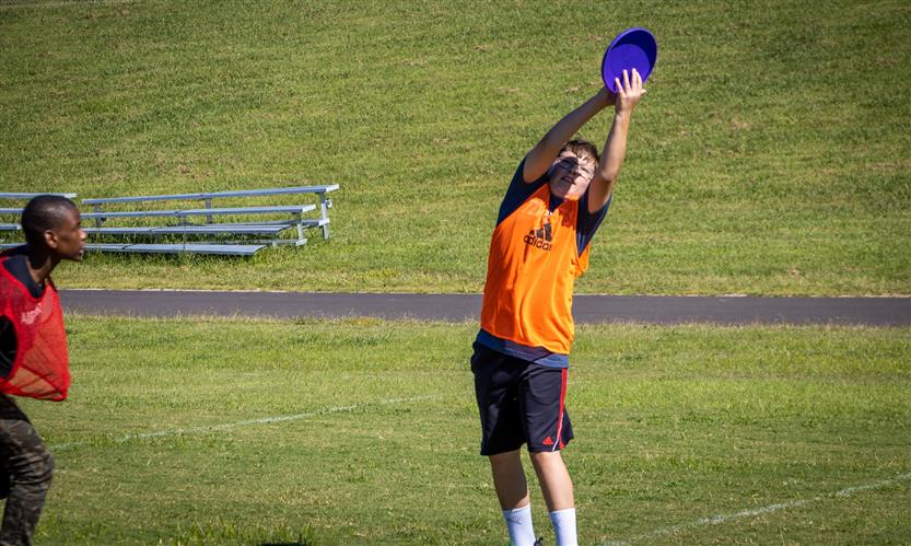 Students play ultimate frisbee